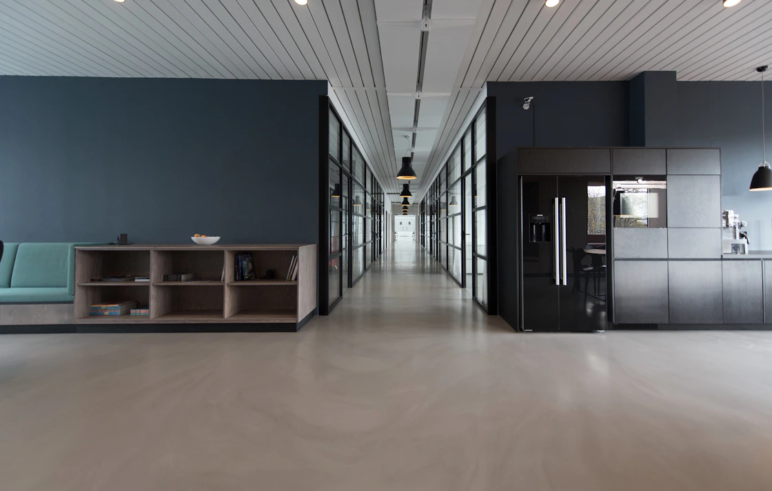 Modern coworking space with open desks and private offices available for online booking with SlotPress
