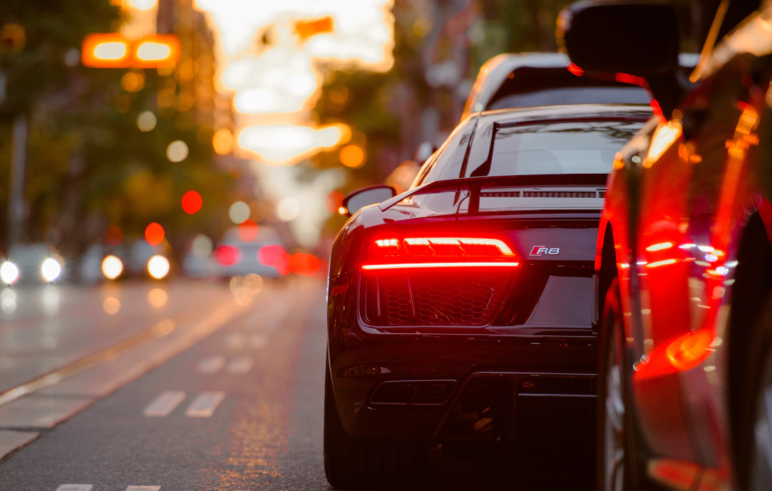 Fleet of rental cars parked in a row, bookable online with SlotPress